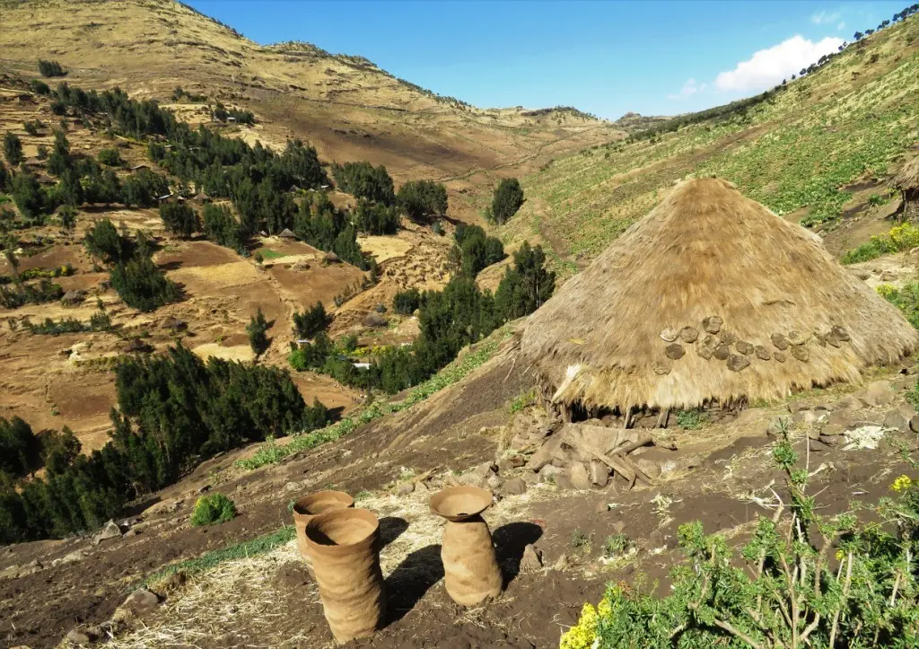 A house in Argin, barley store jars made of cow dung drying in the sun